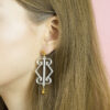 Kolczyki Crystal Logo Earrings marki Romańska